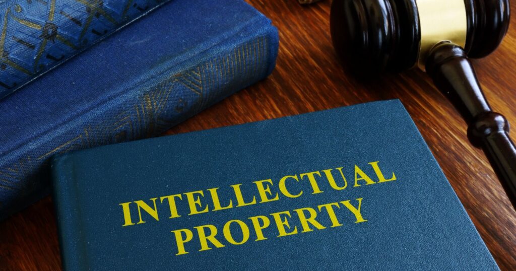 A stack of books with a copyright symbol on top, representing intellectual property rights.