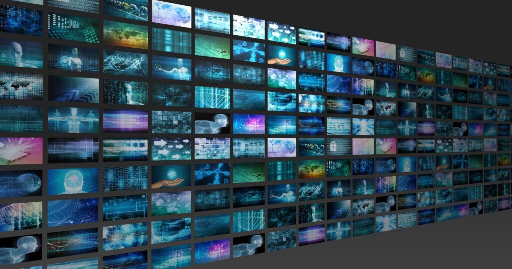 A wall of video screens displaying various images, showcasing the significant role of AI in modern content creation.