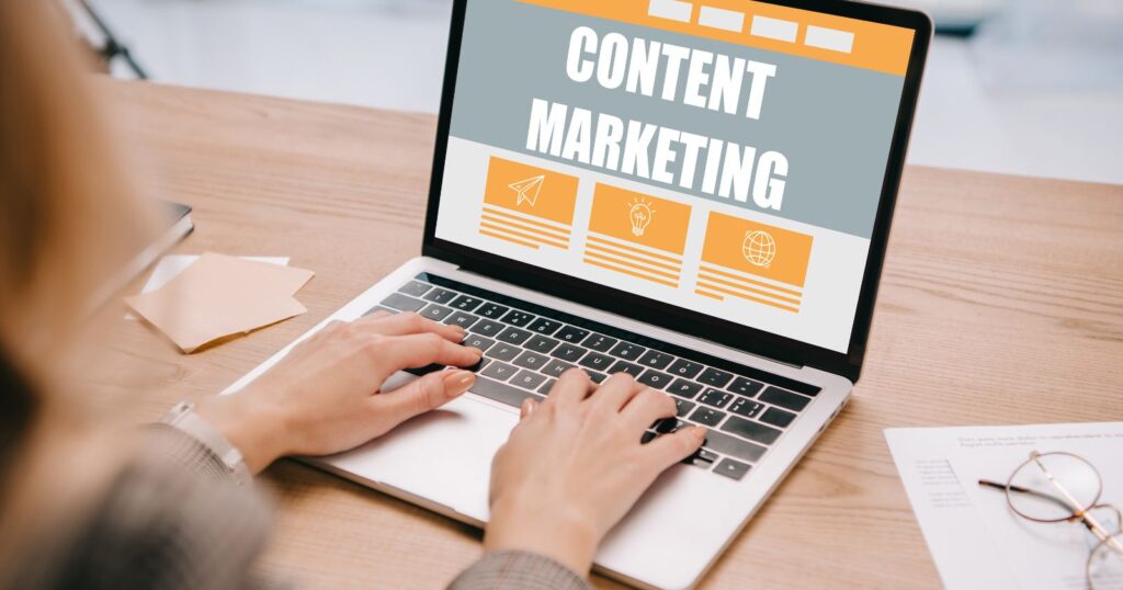 A woman using Laptop showing a content marketing.