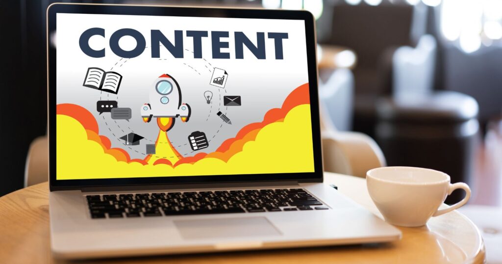 A person typing on a laptop, creating content for a website. They are utilizing technology to enhance their marketing strategies.