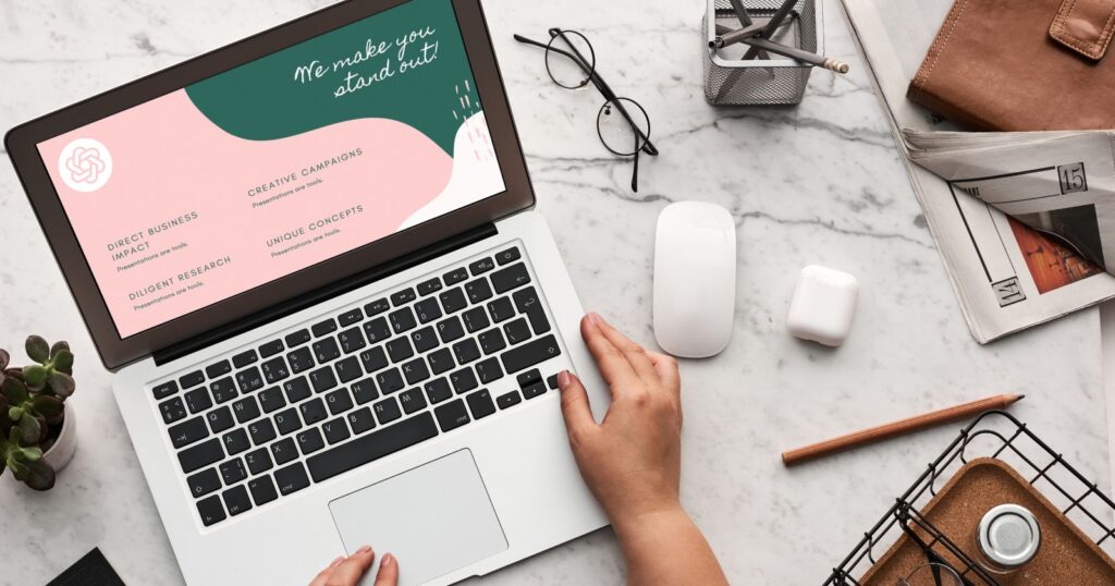A woman's hands on a laptop, showcasing a business card mockup, highlighting the role of ChatGPT & AI in modern marketing.