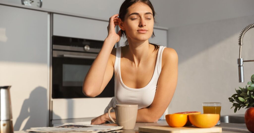 A person sitting at a desk, surrounded by a calendar, clock, and to-do list, symbolizing the power of routine in daily life.