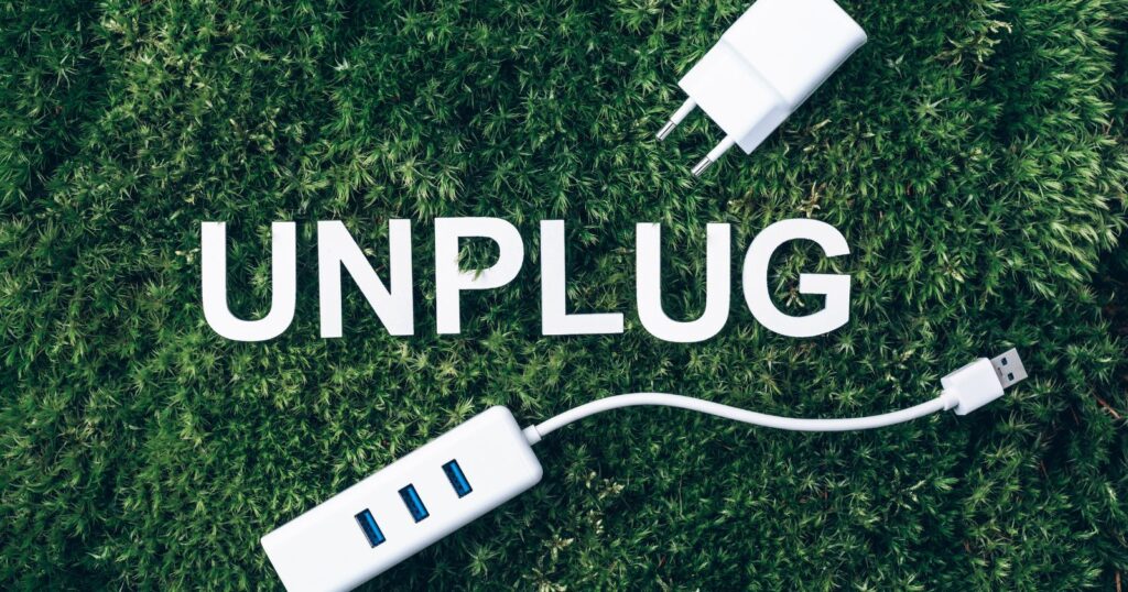 Phone being unplugged from wall socket to recharge.